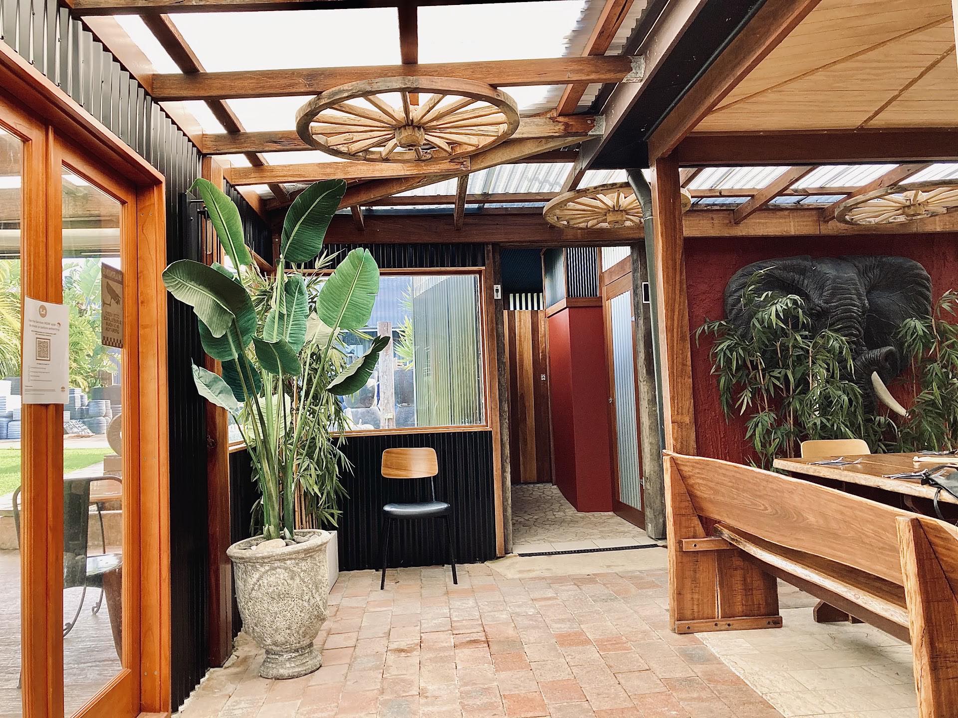 Inside Emerson's on Main — timber walkways, wagon wheels and greenery